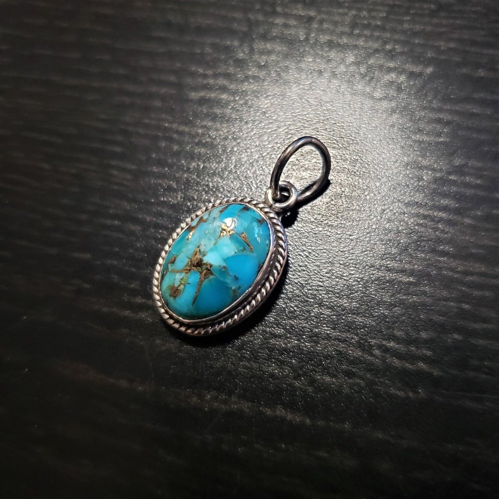 925 silver pendant with a turquoise cabochon.